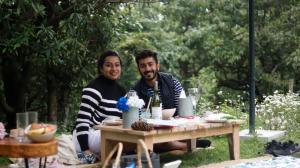 a man and a woman sitting at a table at Everest Base Camp, Near George Everest House, 5kms from Library chowk in Mussoorie
