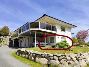 a house with a red ring in front of it at Quiet and comfy with swimming pool in Onsala