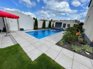 a swimming pool in the backyard of a house at Apartment Nürnberg in Nürnberg