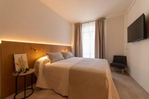 Postel nebo postele na pokoji v ubytování Nema Boutique Hotel & Spa
