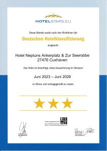 um bilhete para um hotel com estrelas douradas em Hotel Neptuns Ankerplatz em Cuxhaven