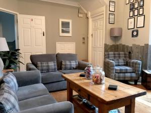 a living room with couches and a coffee table at St Bernards in Newquay