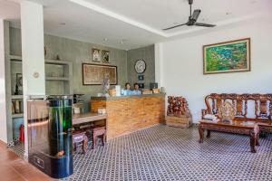 a large room with a fish tank in the middle at Savada Angkor Boutique Hotel in Siem Reap