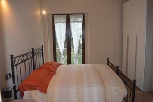 Ένα ή περισσότερα κρεβάτια σε δωμάτιο στο Podere San Marco