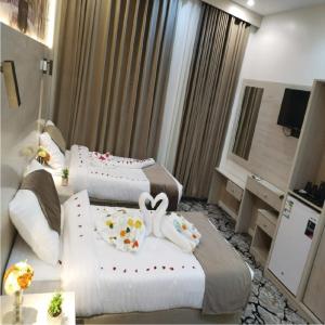Postel nebo postele na pokoji v ubytování فندق اسكنت الحفاير - Askant Al Hafayer Hotel