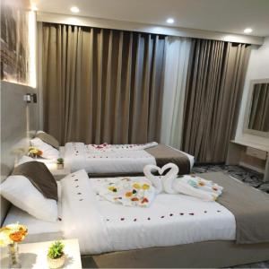 Postel nebo postele na pokoji v ubytování فندق اسكنت الحفاير - Askant Al Hafayer Hotel