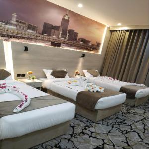 Postel nebo postele na pokoji v ubytování فندق اسكنت الحفاير - Askant Al Hafayer Hotel