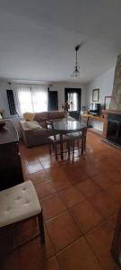 a living room with a table and a couch at Casa Rural Mirador De La Luna in Hornos