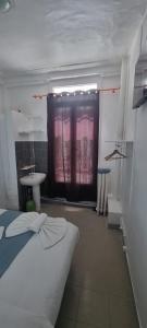 Cama ou camas em um quarto em Hotel Aboukir