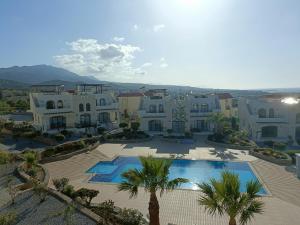 an aerial view of a villa with a swimming pool at Sunny, big pool, garden-roof terrace view Cornervilla on area Kyrenia-Bahceli North-Cyprus in Bahçeli