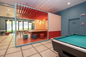 a billiard room with a pool table in it at MEININGER Venezia Mestre in Mestre