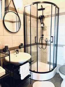 a bathroom with a shower and a sink at Apartment Blue&Green in Kostrena