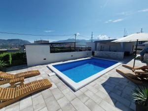 a swimming pool on the roof of a house at Casa Bella in Split