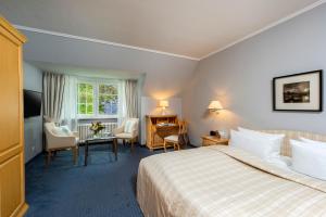 Ένα ή περισσότερα κρεβάτια σε δωμάτιο στο Landhaus Carstens