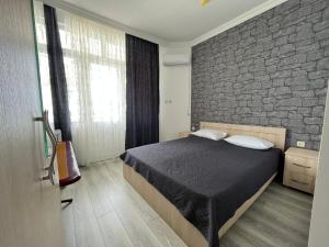 Postel nebo postele na pokoji v ubytování Zuri Kvariati