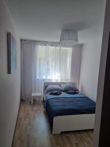 Een bed of bedden in een kamer bij Park Alice Apartment