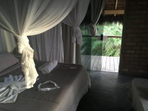 Llit o llits en una habitació de Pousada Mar dos Algodões - Praia de Algodões