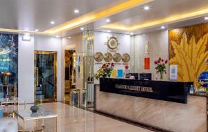 a lobby of a store with a reception counter at Diamond Luxury Hotel in Ha Long