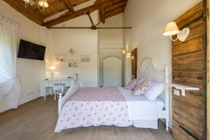 Postel nebo postele na pokoji v ubytování B&B Podere Curtatone