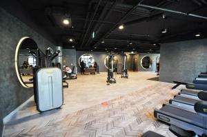 a gym with dumbbells and exercise equipment in a room at Bright Lovely Deluxe 1bd Condopoolviews! #134 in Istanbul