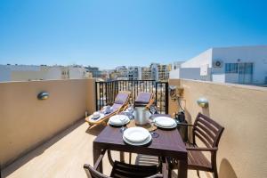 A balcony or terrace at Sea Bliss penthouse with 2 terraces enjoying side Sea views by Getawaysmalta
