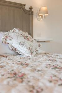 Postel nebo postele na pokoji v ubytování B&B Podere Curtatone