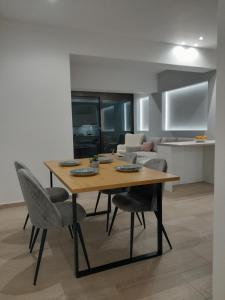 a dining room table and chairs in a room at Central House 2 in Ancient Epidauros +13 photos