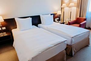 Posteľ alebo postele v izbe v ubytovaní Crowne Plaza Bratislava by IHG