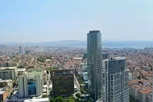 an aerial view of a city with a tall building at Beautiful Modern 1bd Condo Views W Poolgym! #223 in Istanbul