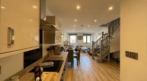 a kitchen with a counter and a dining room at 3 chapel row cottages in Wirksworth