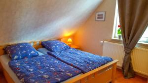 Postel nebo postele na pokoji v ubytování Ferienwohnung am Dorfrand