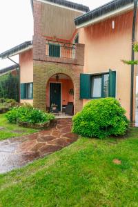 a house with a porch and a patio at Casa Jennifer nel Delta del Po in Taglio di Po