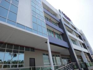 a large building with a lot of windows at Galaxy Hotel SIMPANG AMPAT in Simpang Ampat