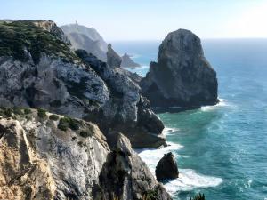 a view of the ocean from a cliff at Casa Mateus - Colares, Parque Natural Sintra Cascais in Sintra