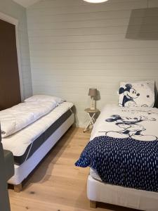 מיטה או מיטות בחדר ב-Chalet Eau Vive
