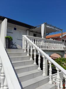 a white staircase in front of a house at AnKaLo in Vir