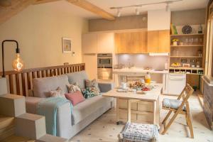 a living room with a couch and a table at The Wooden House VV in Las Palmas de Gran Canaria