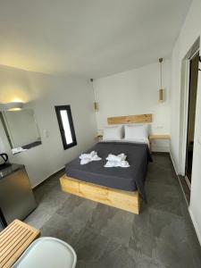 Postelja oz. postelje v sobi nastanitve Sun Springs Suites