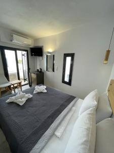 Postelja oz. postelje v sobi nastanitve Sun Springs Suites