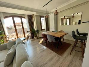 a living room with a couch and a table at Renovu Premium Homes in Cihangir in Istanbul