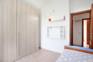 Ένα ή περισσότερα κρεβάτια σε δωμάτιο στο Villino Funtana 2