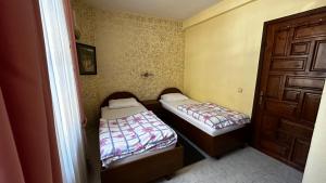 Postel nebo postele na pokoji v ubytování Sultan Pension
