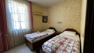 Postel nebo postele na pokoji v ubytování Sultan Pension