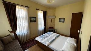 Postel nebo postele na pokoji v ubytování Sultan Pension