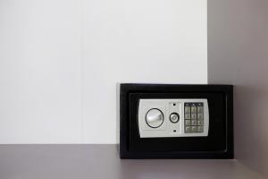 a black and white safe in a white wall at Villa Dionysia Studio S7 in Alikanas