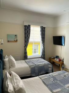 Cama ou camas em um quarto em The Red Lion Hotel