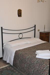 מיטה או מיטות בחדר ב-Casa Montefranco