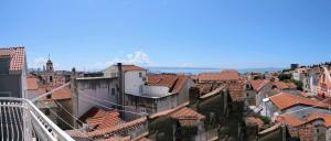a view of a city with roofs and buildings at Guest House Periko in Split