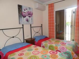 Postel nebo postele na pokoji v ubytování DUPLEX AL ANDALUS THALASSA + 31 fotografií