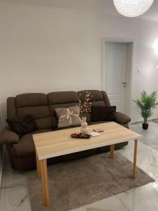 a living room with a couch and a coffee table at Apartment Nitra-city centre in Nitra